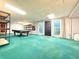 Finished basement area with pool table, shelving, and walk out at 8710 Mount Rushmore Dr, Johns Creek, GA 30022