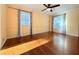 Bright bedroom with hardwood floors and large windows allowing for ample natural light at 8710 Mount Rushmore Dr, Johns Creek, GA 30022