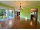 Dining room boasting hardwood floors, a chandelier, and access to the kitchen at 8710 Mount Rushmore Dr, Johns Creek, GA 30022