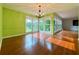 Bright and airy dining room featuring hardwood floors and a chandelier at 8710 Mount Rushmore Dr, Johns Creek, GA 30022