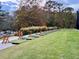 Well-equipped driving range with multiple hitting bays and manicured grass, perfect for practice at 8710 Mount Rushmore Dr, Johns Creek, GA 30022