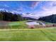 Breathtaking view of the meticulously maintained golf course with lush greenery and a serene pond at 8710 Mount Rushmore Dr, Johns Creek, GA 30022