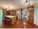 Open concept kitchen with wooden cabinets, stainless steel appliances, and a cozy island at 8710 Mount Rushmore Dr, Johns Creek, GA 30022