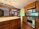 Charming kitchen featuring custom wood cabinets, stainless steel appliances, and granite countertops at 8710 Mount Rushmore Dr, Johns Creek, GA 30022