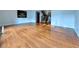 Spacious living room features gleaming hardwood floors and plenty of natural light at 8710 Mount Rushmore Dr, Johns Creek, GA 30022