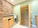 Pantry with brick wall, wooden shelving, and sink at 8710 Mount Rushmore Dr, Johns Creek, GA 30022