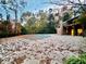 Community pool covered for off-season, set in a wooded area with ample deck space and nearby facilities at 8710 Mount Rushmore Dr, Johns Creek, GA 30022