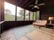 Relaxing screened porch with comfortable seating and scenic views of the surrounding nature at 8710 Mount Rushmore Dr, Johns Creek, GA 30022
