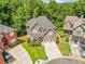Beautiful craftsman home featuring well-manicured lawn, three-car garage, and mature trees in a desirable neighborhood at 931 Hidden Falls Se Ln, Smyrna, GA 30082