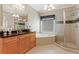 Well-lit bathroom with large vanity, soaking tub, and glass-enclosed shower at 931 Hidden Falls Se Ln, Smyrna, GA 30082