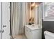 Bathroom with vanity, decorative curtains, and modern fixtures at 931 Hidden Falls Se Ln, Smyrna, GA 30082