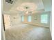 Spacious bedroom with trey ceiling, a ceiling fan, and multiple windows at 1540 Ox Bridge Ct, Lawrenceville, GA 30043