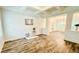 Spacious dining room with hardwood floors, a coffered ceiling, and wainscoting at 1540 Ox Bridge Ct, Lawrenceville, GA 30043