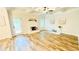 Living room features tray ceilings, a white brick fireplace, access to the outdoor and new hardwood flooring at 1540 Ox Bridge Ct, Lawrenceville, GA 30043