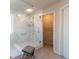 This is a bathroom with a glass shower, marble tile, and a dressing area at 3126 Cove View Ct, Dacula, GA 30019