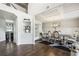 Dining area adjacent to the foyer featuring a modern chandelier, sleek table and chairs, and geometric rug at 3126 Cove View Ct, Dacula, GA 30019