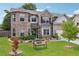 Beautiful two-story home with brick and siding, green lawn, mature landscaping and welcoming front porch at 3126 Cove View Ct, Dacula, GA 30019