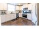 Beautiful kitchen featuring stainless steel appliances, granite countertops, and sleek white cabinets at 3126 Cove View Ct, Dacula, GA 30019