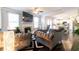 Comfortable living room with modern decor, fireplace, large windows, and open access to kitchen at 3126 Cove View Ct, Dacula, GA 30019