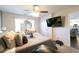 Well-lit main bedroom boasts natural light, and a mounted flatscreen TV at 3126 Cove View Ct, Dacula, GA 30019