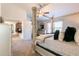 This is a bedroom with a four-poster bed, carpet, and access to another room at 3126 Cove View Ct, Dacula, GA 30019