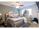 Main bedroom featuring a large bed with mirrored accents, a mirrored dresser and the name YVONNE in the window at 3126 Cove View Ct, Dacula, GA 30019