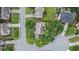 Aerial view of a residential area with a house situated in a circular street layout at 300 Windsor Chase Trl, Johns Creek, GA 30097