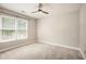 Neutral bedroom with carpet flooring, a ceiling fan and natural light at 300 Windsor Chase Trl, Johns Creek, GA 30097