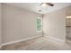Carpeted bedroom with neutral walls and natural light at 300 Windsor Chase Trl, Johns Creek, GA 30097