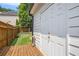 Showing a side of a home featuring white doors and well-maintained landscaping at 300 Windsor Chase Trl, Johns Creek, GA 30097