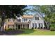 Charming two-story home with black shutters, stone accents, and a beautifully landscaped front yard at 300 Windsor Chase Trl, Johns Creek, GA 30097