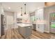Bright kitchen with stainless appliances, shaker cabinets and center island with white countertop at 300 Windsor Chase Trl, Johns Creek, GA 30097
