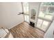 Open concept living room with fireplace, hardwood floors, and high ceilings at 300 Windsor Chase Trl, Johns Creek, GA 30097