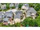 Aerial view of neighborhood with pool, playgrounds, well-manicured lawns and mature trees at 1122 Parkview Pl, Smyrna, GA 30080