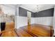 Elegant dining room featuring hardwood floors, wainscoting, and a stylish chandelier at 1122 Parkview Pl, Smyrna, GA 30080