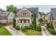 Charming two-story home featuring a covered front porch, manicured landscaping, and craftsman-style architecture at 1122 Parkview Pl, Smyrna, GA 30080