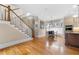Open kitchen featuring granite counters, stainless steel appliances, breakfast nook, and stairs at 1122 Parkview Pl, Smyrna, GA 30080