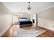 Comfortable main bedroom featuring a vaulted ceiling, a ceiling fan, and a cozy rug at 1122 Parkview Pl, Smyrna, GA 30080