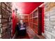 Wine cellar featuring stone walls, climate control, and ample storage at 1122 Parkview Pl, Smyrna, GA 30080