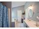 Primary bathroom features tub, shower, and double sinks with modern fixtures at 1055 Kibbe Cir, Lawrenceville, GA 30044