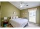 Bedroom features plush carpet, natural light and a ceiling fan at 1055 Kibbe Cir, Lawrenceville, GA 30044