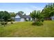 Well-kept single-story home featuring lush green lawn, a gray garage door, and nice landscaping at 1055 Kibbe Cir, Lawrenceville, GA 30044