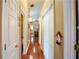 Hallway features hardwood floors, ample closet space and connects rooms in the home at 1055 Kibbe Cir, Lawrenceville, GA 30044