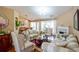 Bright, spacious living room boasting hardwood floors, a fireplace, and an open layout to dining at 1055 Kibbe Cir, Lawrenceville, GA 30044