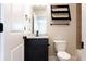 Bathroom features modern finishes and a dark wood vanity with a granite countertop at 1110 Bakary Ct, Decatur, GA 30032
