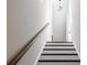 Staircase with wood handrail and white risers leads to the next level at 1110 Bakary Ct, Decatur, GA 30032