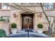 Elegant entrance to the building featuring double doors, classic architecture, and manicured potted greenery at 1717 N Decatur Ne Rd # 117, Atlanta, GA 30307