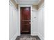 Elegant entry door with dark wood finish and classic trim, complemented by neutral wall colors at 1717 N Decatur Ne Rd # 117, Atlanta, GA 30307