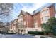 Stately brick condominium building with beige accents and lush landscaping at 1717 N Decatur Ne Rd # 117, Atlanta, GA 30307