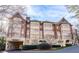 Impressive condominium building featuring brick and beige facade, and elegant design at 1717 N Decatur Ne Rd # 117, Atlanta, GA 30307
